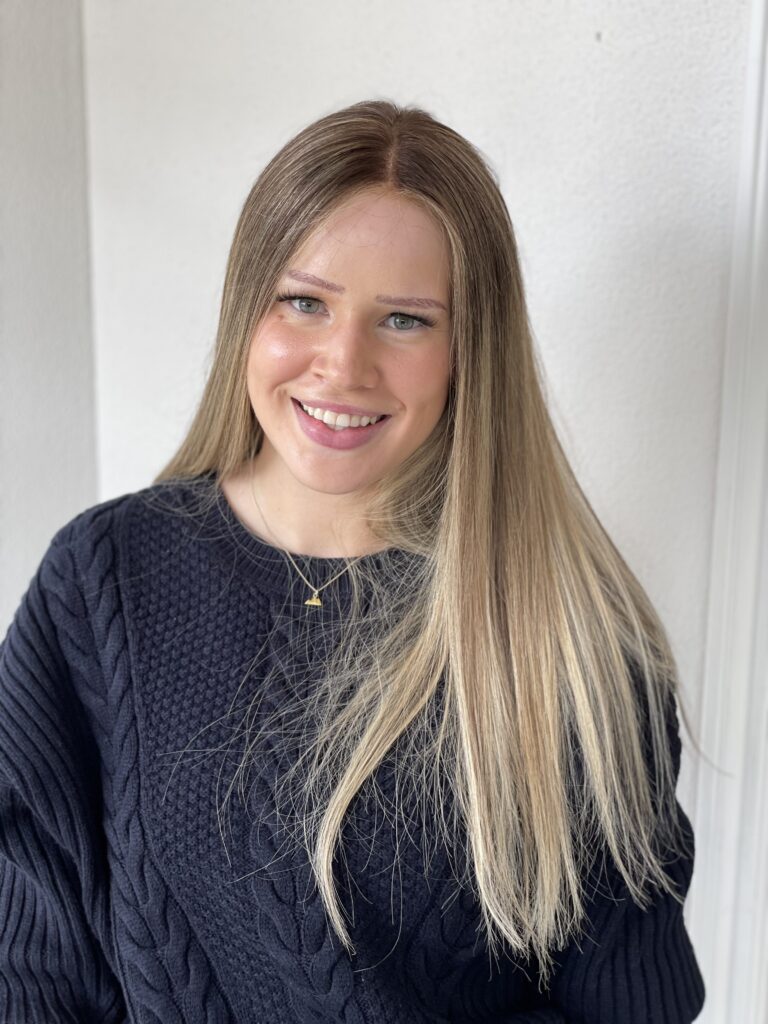 Woman wearing blonde human hair wig