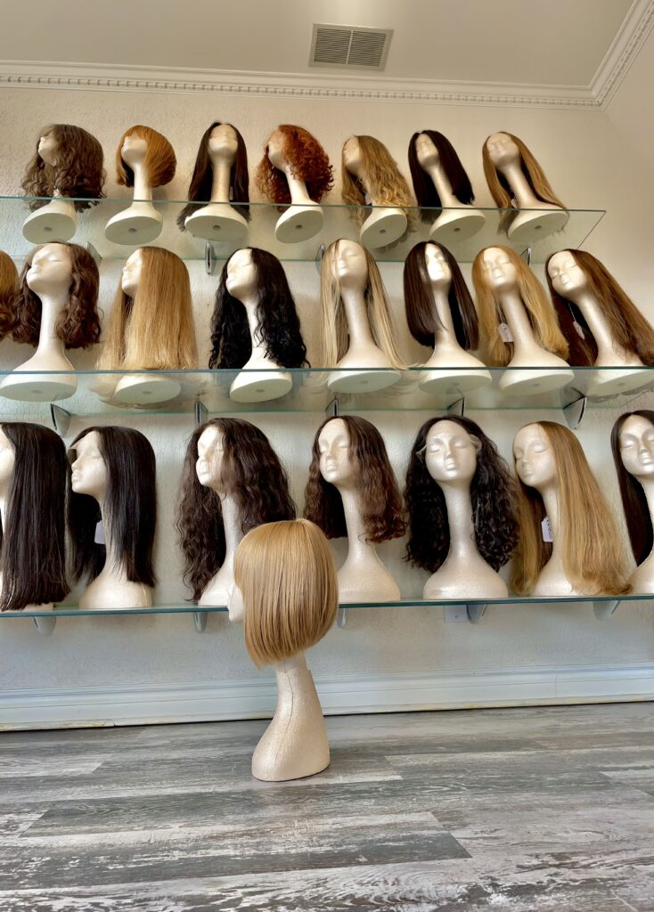 Custom Wigs on shelves in our Toronto Wig Shop