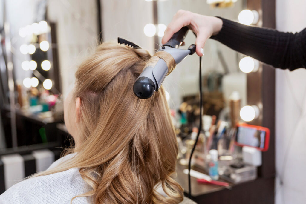 Woman having her custom wig styled at the salon