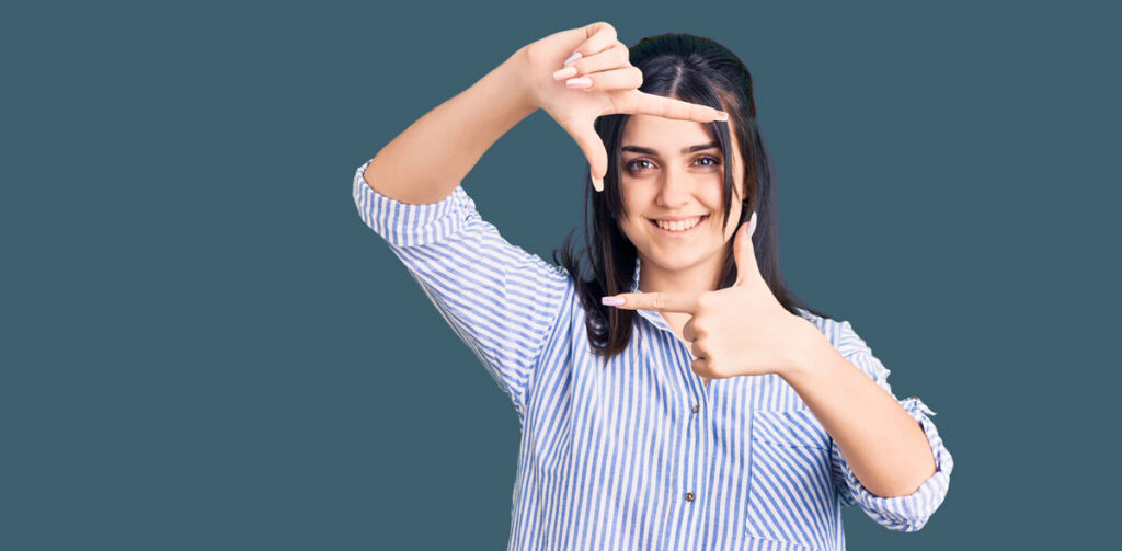 Woman framing her face with her hands